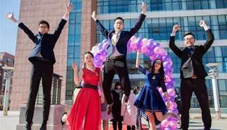 Students cheer at adult ceremony in north China